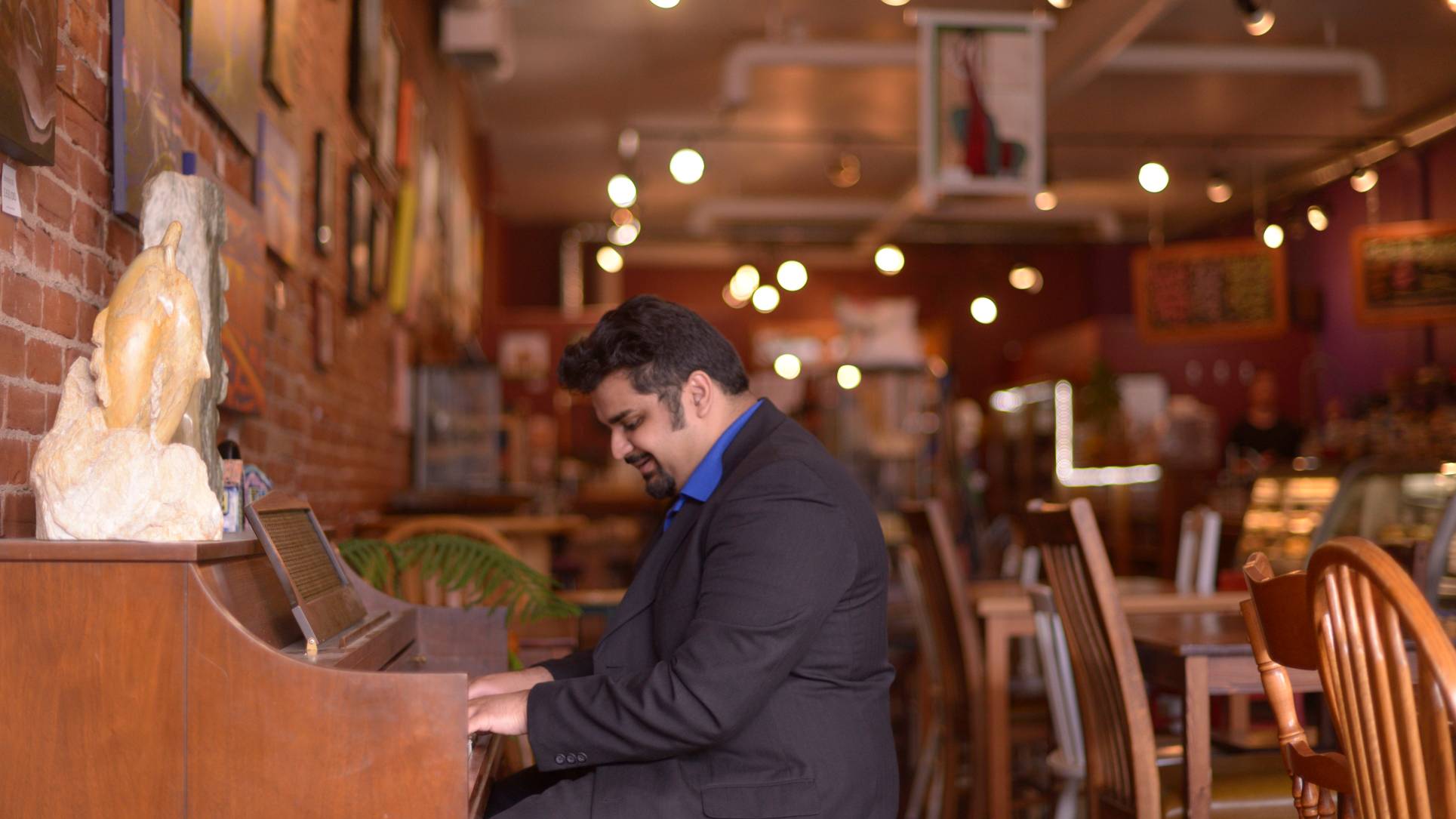 Playing the Piano at The Art We Are cafe